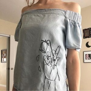 Hand embroidered off the shoulders light blue shirt with hand and rose design